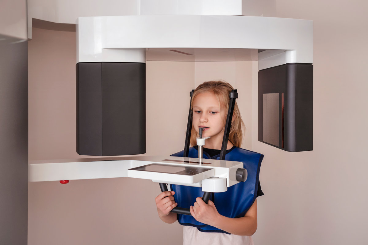 Orthopantomogram Digital image for Children OPG CT Scan X-Ray. Child Little Girl Make Panoramic single Image Radiograph Mandible, Maxilla and Teeth.