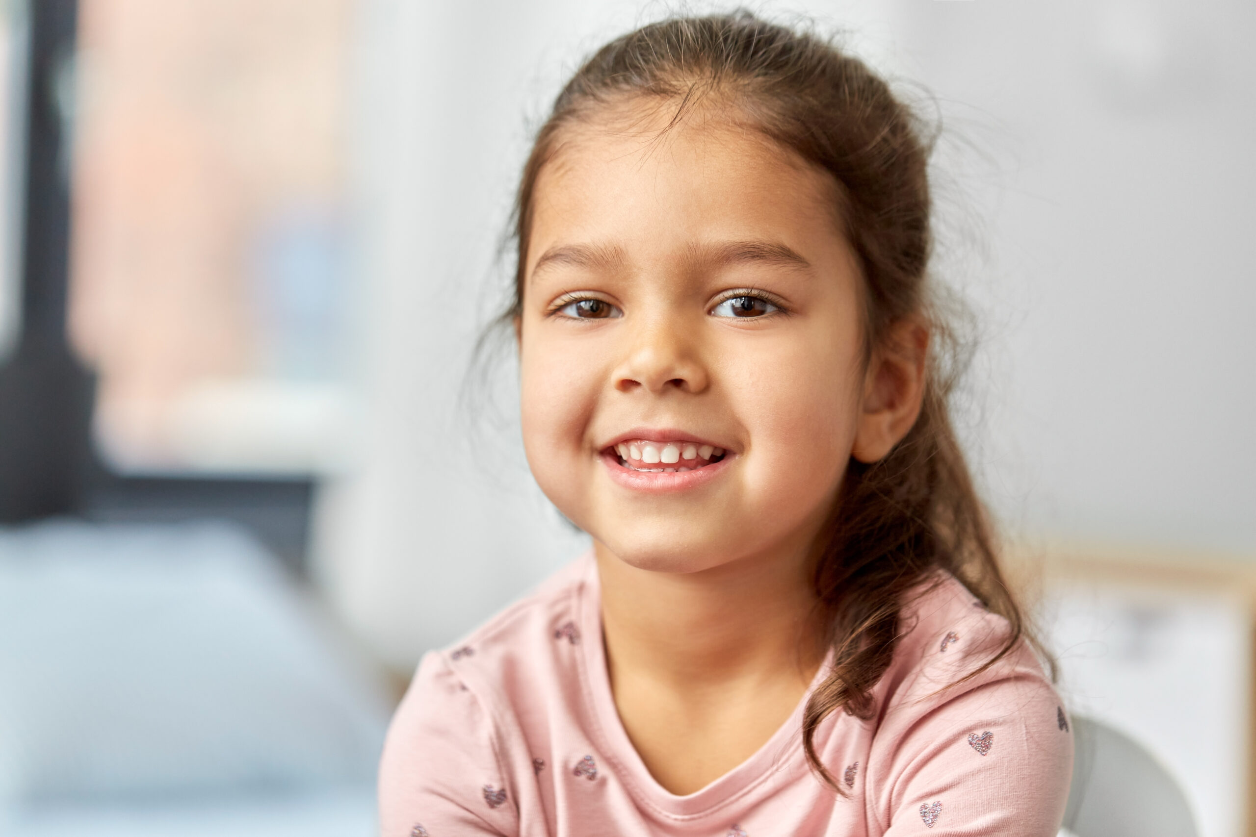 Happy smiling little girl at pediatric dental visit
